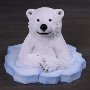 Peeking polar bear cub