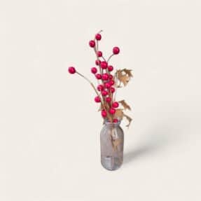 Flesje met bessentak